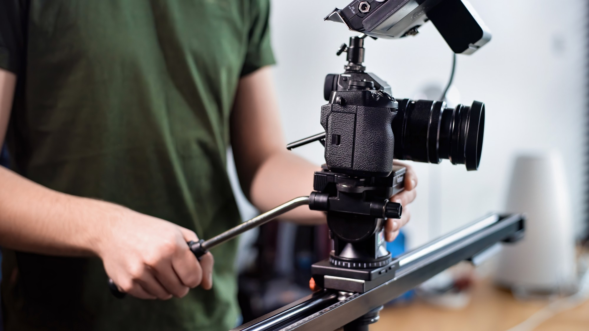young-content-creator-man-filming-with-camera-slider-professional-rig